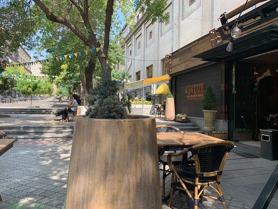 The leafy street-side terrace of the Asador restaurant in central Yerevan