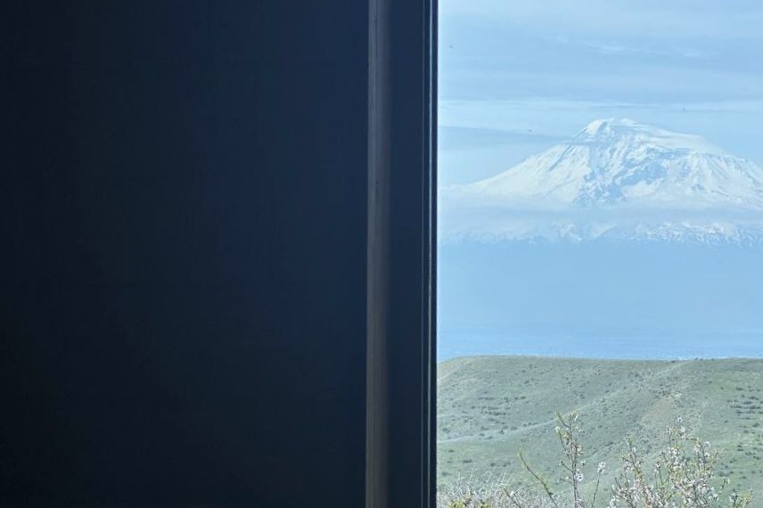 A window at Hoja Place framing Mount Ararat