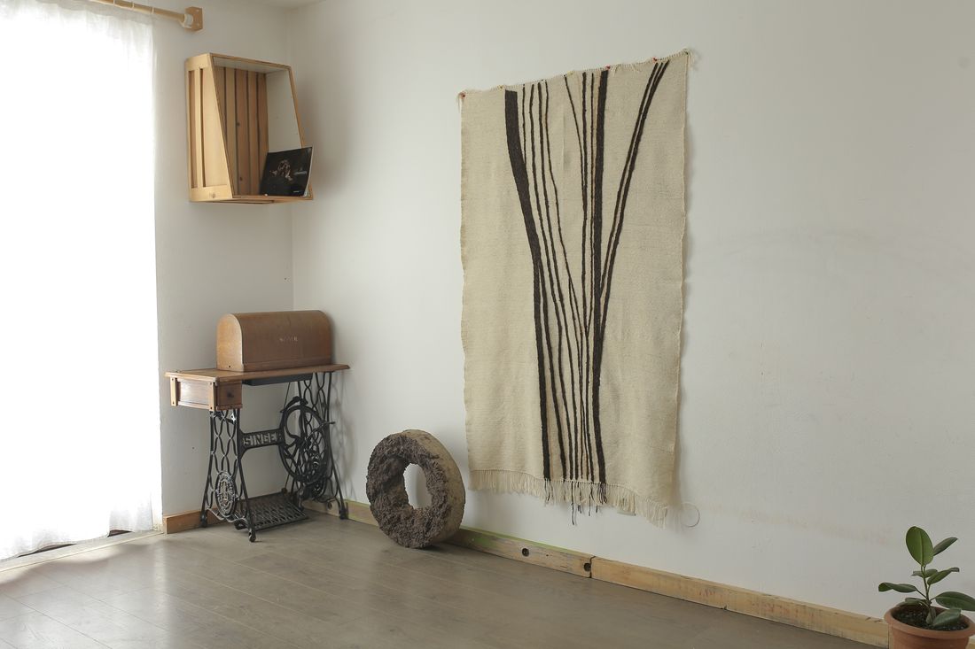 Prelude blanket hung on a wall in an interior