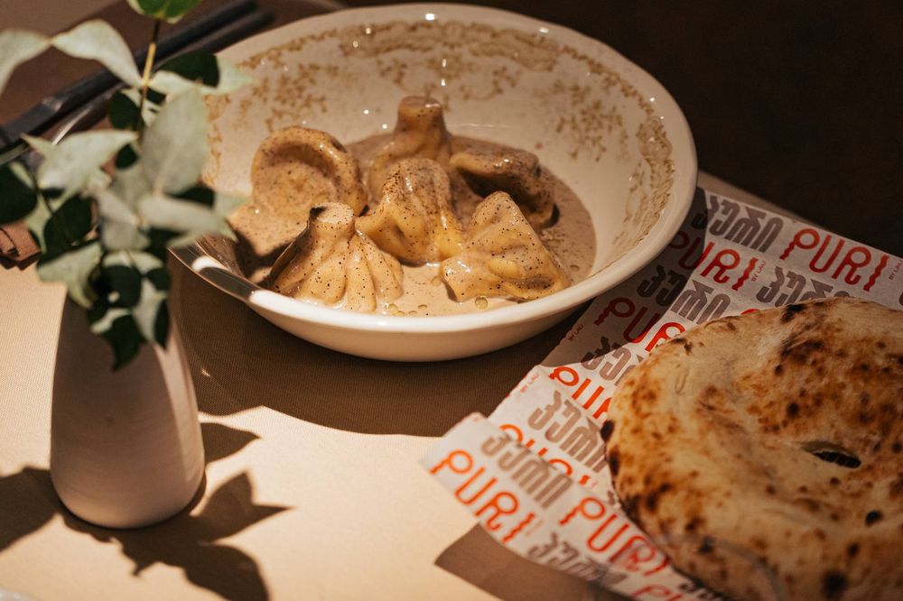 Khinkali dumplings in a creamy sauce at Puri