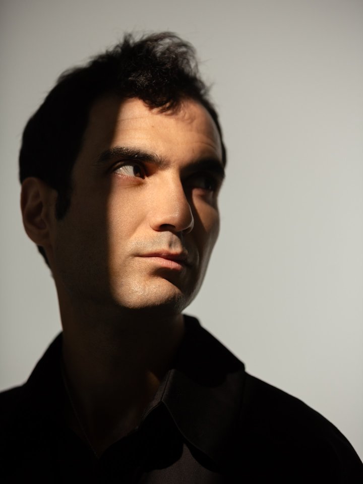 Portrait of Tigran Hamasyan in dramatic light